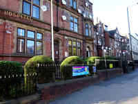 front of Sheffield Children's Hospital with freshly pruned shrubs