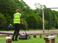 landscaping contractors grass cutting on play area in Sheffield, South Yorkshire