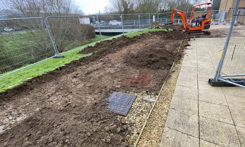 The ground being excavated during the landscape renovation