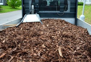 A pick-up truck filled with mulch